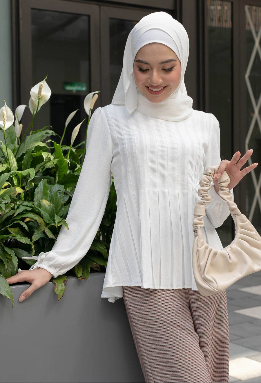 Perla Pleats Peplum Top